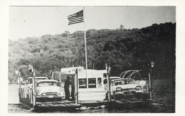 The Merrimac ferry "Colsac" with an American flag.