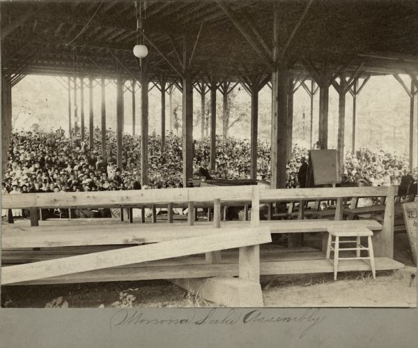 View from inside of the Monona Lake Assembly Meeting Pavilion looking out on a large crowd of people.