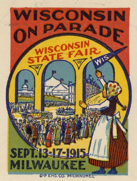 Color stamp used to advertise the Wisconsin State Fair. The illustration shows a crowd arriving at the fairgrounds, while a young girl in an ethnic costume waves a Wisconsin pennant. The stamp was printed by the G-P Engraving Co. of Milwaukee.