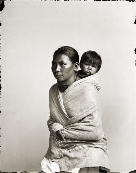 Studio portrait of Ho-Chunk woman and child.