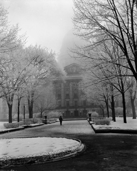 The Wisconsin State Capitol and park covered in hoar frost and fog.