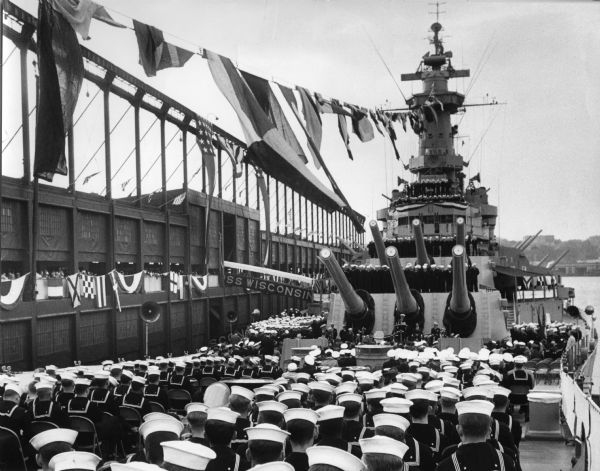 Uniformed sailors gathered on the deck of the U.S.S. <i>Wisconsin</i> during decommissioning ceremonies.