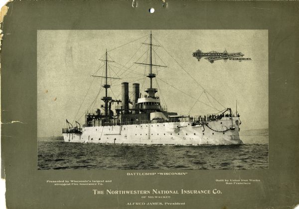 Battleship U.S.S. <i>Wisconsin</i> at sea with several men on deck. The mounted photograph was a promotional item for Northwestern National Insurance, Co.