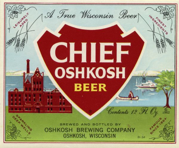 Label for Chief Oshkosh Beer with an arrowhead-shaped shield in the center bearing the name of the brew. There is also a depiction of the brewery with Lake Winnebago in the background. There is a Native American wearing a head dress in a canoe and a steamboat on the lake. Line drawings of hops and stalks of wheat also decorate the label.