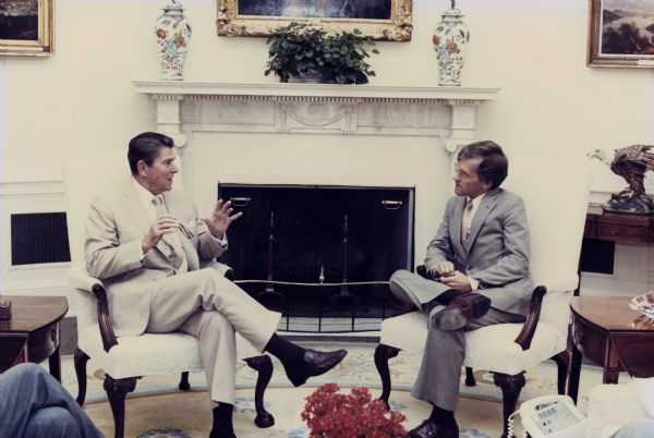 Ronald Reagan (left) speaks with Steve Gunderson (right).
