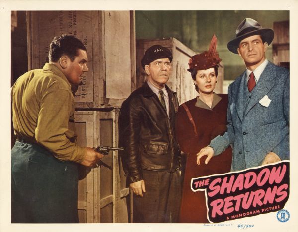 Lobby card for the Monogram film "The Shadow Returns," showing a scene with Kane Richmond (playing Lamont Cranston), Barbara Reed (playing Margo Lane), Tom Dugan (playing Shrevvy), and an unidentified actor.