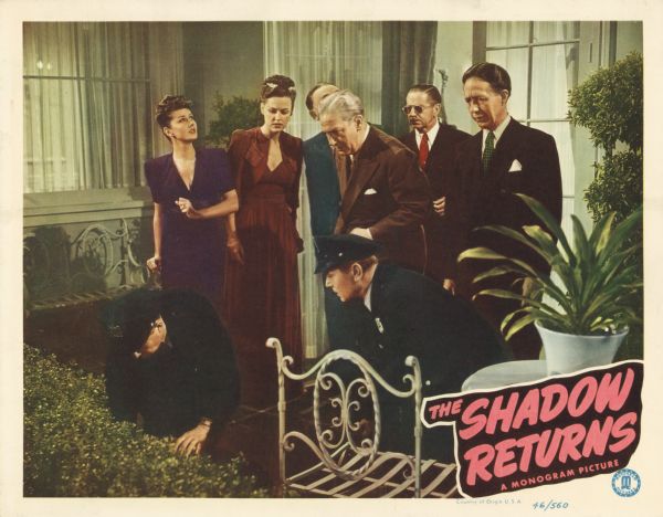 Lobby card for the Monogram film "The Shadow Returns," featuring several characters on a patio investigating a body that has just fallen from the roof.