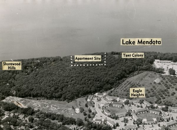 Aerial view of Eagle Heights Farm, Eagle Heights Woods and part of Lake Mendota. Sites labeled on the image are Eagle Heights, Tent Colony, Apartment Site, and Shorewood Hills. University Houses are at bottom right and University Apartments Community Garden are near bottom left.