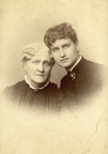 Vignetted studio portrait of Eliza Catherine Scidmore and Eliza Ruhumah Scidmore posing together.