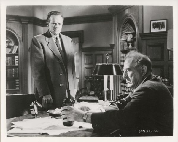 Movie still from the United Artists movie "Patterns," featuring Van Heflin (playing Fred Staples) and Everett Sloane (playing Mr. Ramsey).