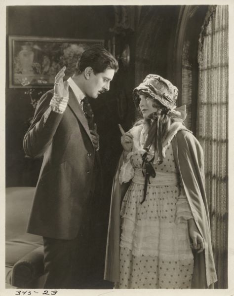 Scene still from the American Film Co. silent film "The Intrusion of Isabel," featuring Alan Forrest (playing Jack Craig) and Mary Miles Minter (playing Isabel Trevor).