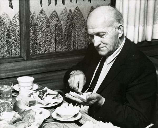 Wisconsin Assemblyman Ben Riehle, a Democrat from Athens, spreads real butter on his bread at a restaurant near the Wisconsin State Capitol.  Riehle, a dairy farmer and one of the staunchest opponents of legalizing the sale of yellow oleomargarine in Wisconsin.  
