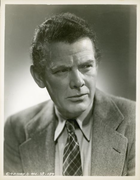 Publicity still of actor Charles Bickford, wearing a plaid tie.