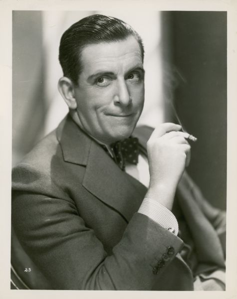 Publicity still of actor Edward Everett Horton, posing with a cigarette.