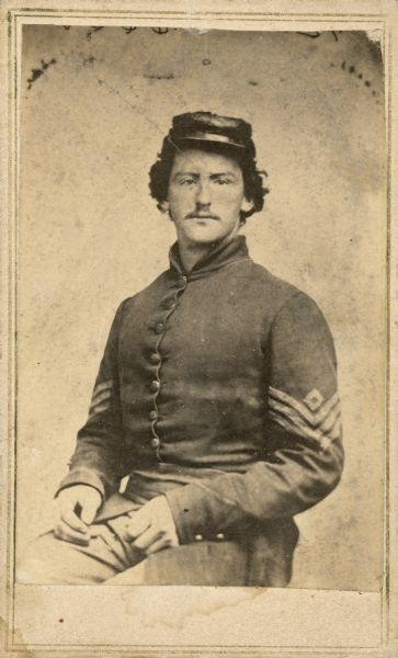 Studio portrait of 2nd Lieutenant Henry Clay Taylor (1838-1864), 21st Wisconsin Infantry, Company A, wearing a Union soldier's uniform.  Henry was a bookkeeper in Fond du Lac, Wisconsin when he enlisted on August 13, 1862 as a sergeant. He was captured at the Battle of Chickamauga (September 1863) and sent to Libby Prison. Around May of 1864 he became sick and was first sent to a prison hospital in Macon, Georgia and then to one in Charleston, South Carolina. He died there supposedly on December 12, 1864, but letters to his father (located in the Wisconsin Historical Archives) indicate he probably died the first week of October.