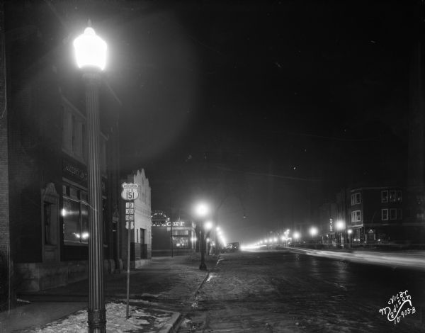 View of 500 and 600 blocks of University Avenue at night, looking west from West Gilman Street.