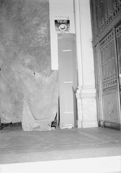 A view of the ornate Otis elevator originally installed in the Historical Society building in 1900. This picture, taken on the second floor during remodeling, also shows a dust curtain (and an upside down poster on the wall) protecting the entrance to room 208 from construction debris.
