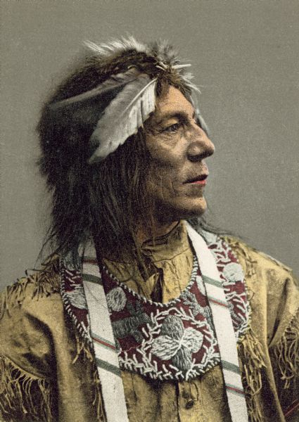 Hand-colored postcard depicting Ojibwa Chief Obtossaway. This image is part of an exhibit about Native Americans prepared by Paul Vanderbilt, the first curator of photography at the Wisconsin Historical Society.