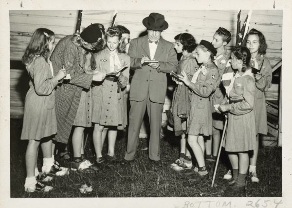 William Evjue with Girl Scouts.