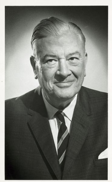 Quarter-length portrait of Robert Tehan in a suit and necktie.