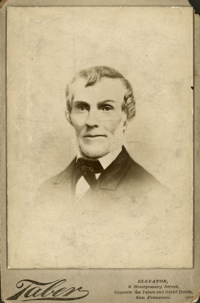 Head and shoulders vignetted studio portrait of Eldai Smith, an early settler in Racine.