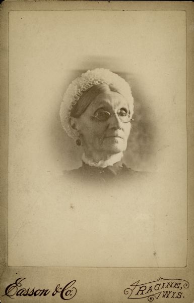 Head and shoulders vignetted studio portrait of Harriet Smith, wife of Eldai Smith, an early settler in Racine.