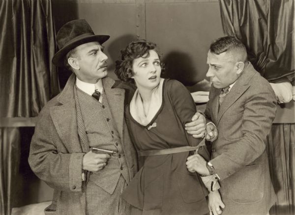 Still from the 1917 Pathé movie "Sylvia of the Secret Service," featuring Irene Castle (playing Sylvia Carroll), captured by the villains.