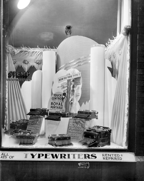 Window display of Royal portable typewriters at the Stemp Typewriter Company, 533 State Street.
