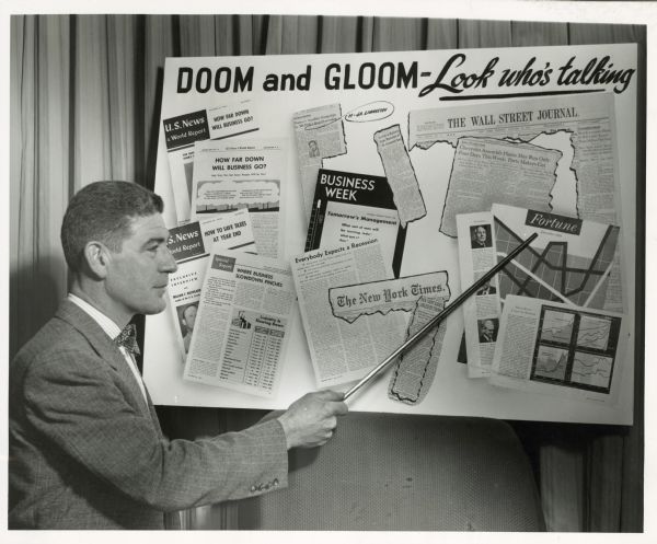 Edward D. Hollander, national director of Americans for Democratic Action, refers to a chart with the title, "Doom and Gloom — Look who's talking".