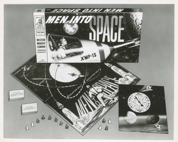 The board game for the television show <i>Men Into Space</i>. It includes game pieces, trivia cards, a game board, and a spinner.