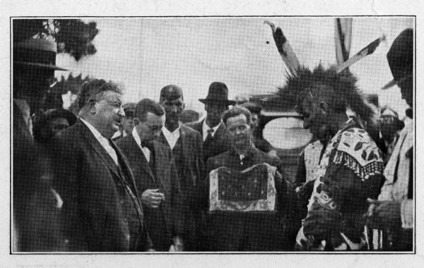 Governor Emmanuel Philipp hearing the petition of a St. Croix Ojibwe (Chippewa) Chief during a Victory Celebration on the Courte Oreilles reservation for the returning Indian soldiers who served in the U.S. Army during the first World War.