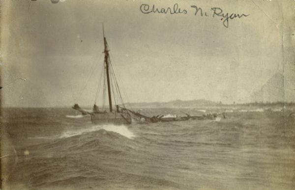 Schooner <i>Charles N. Ryan</i> wrecked in a storm north of Ludington, Michigan on April 18, 1897. Possibly a photograph of the crew being rescued by the Lifesaving Service.