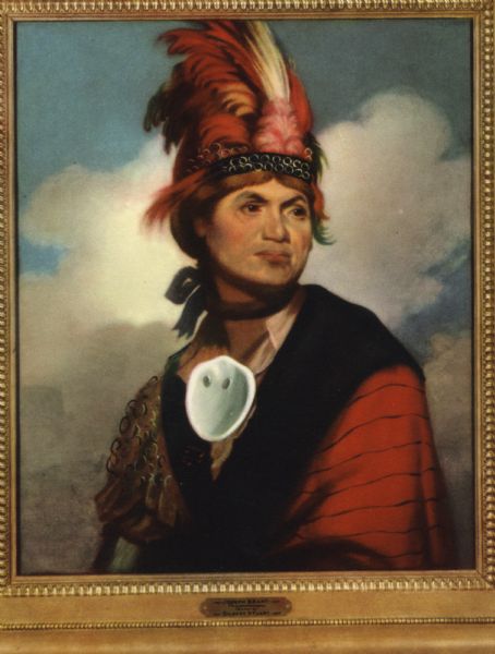 Print of a Gilbert Stuart painted portrait of Thayendangea (known also as Joseph Brant). He wears a feathered headdress and a shell around his neck.