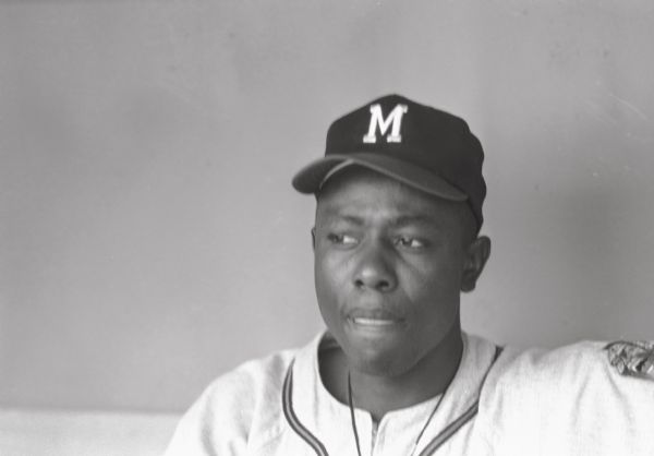Head and shoulders portrait of Henry Aaron in a Milwaukee Braves uniform.