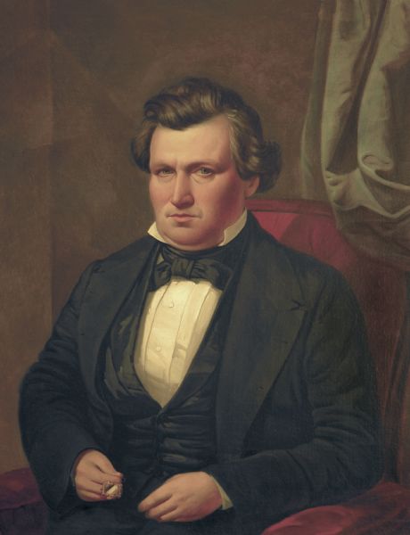 Waist-up seated portrait of Abram D. Smith.