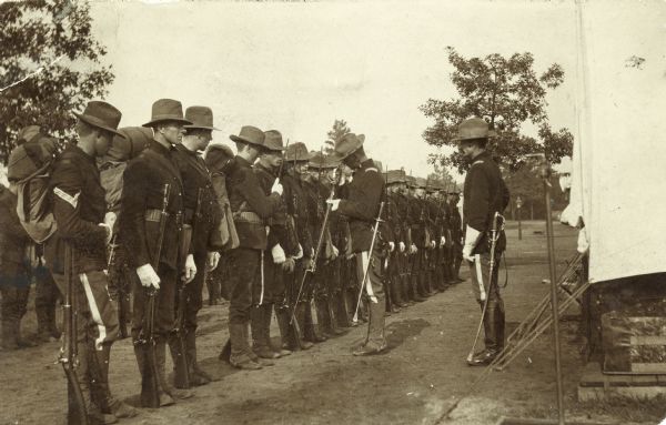 Members of the Wisconsin National Guard lined up at Camp Douglas.