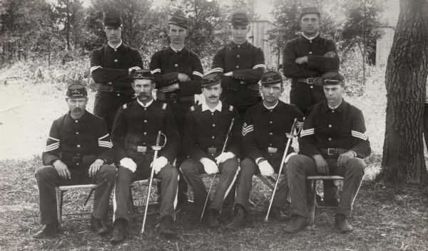 Group portrait of National Guard officers in uniform posed outdoors at Camp Douglas.