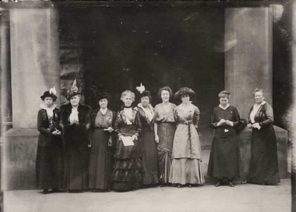 Group portrait of Wisconsin's League of Women Voters. Left to right: unidentified, Jessie Jack Hooper, Mrs. A.J. Rogers [nee Jane Passmore], Mrs. H.M. Youmans [nee Theodora Winton], Mrs. Joseph Jastrow [nee Rachel Szold], Miss Alice Curtis, Ada James (Richland Center), Mrs. Charlotte Jordan [nee Charlotte Hannah] (Kenosha), Miss Emma Robinson (Kenosha).