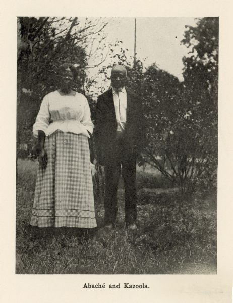 An African American woman and man pose together outdoors. Abaché, also known as Clara Turner, and Kazoola, also known as Cudjoe Lewis, were formerly enslaved people who had been brought to the United States aboard the <i>Clotilda</i>, the last known slave ship to bring captives from Africa to the U.S. They were from present-day Benin, and after emancipation were a part of the community of freedmen known as Africatown in Mobile, Alabama.