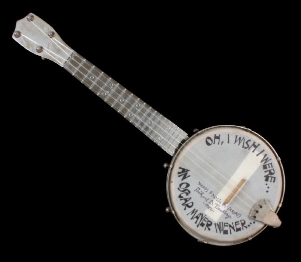 A banjo-ukulele with the words "Oh, I Wish I Were... An Oscar Mayer Wiener..." on the body of the instrument. It was used by Richard Trentlage in the first recording of the Oscar Mayer wiener jingle in 1962.
