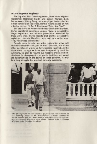 Nathaniel Smith and Ernest Morgan enter the St. Francisville courthouse to vote. Three white men are sitting on a porch railing outside of the courthouse.