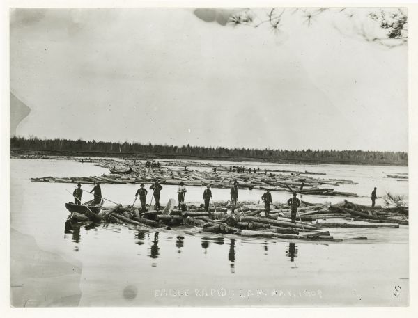 A log driving crew at Eagle Rapids Dam on the Chippewa River. Bottom of print reads: "Eagle Rapids Jam. May, 18-09."
