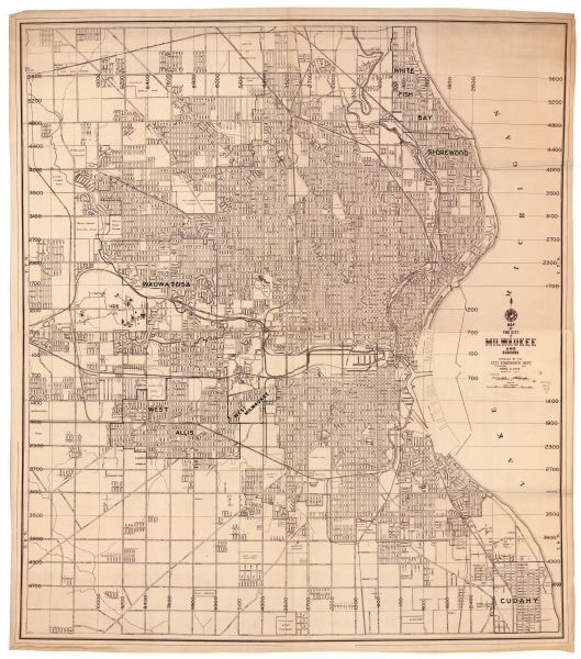 Street map of the city of Milwaukee and surrounding communities at a scale of 1 inch to 1200 feet.