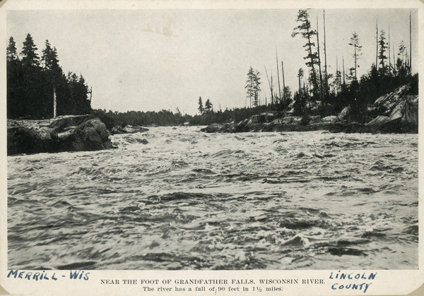Photographic postcard view up the Wisconsin River near the foot of Grandfather Falls, which falls 90 feet in 1 1/2 miles. Caption reads: "Near the foot of Grandfather Falls, Wisconsin River. The river has a fall of 90 feet in 1 1/2 miles."