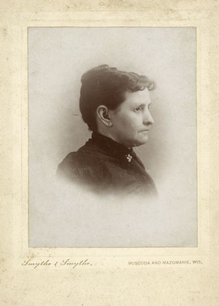 Vignetted quarter-length studio portrait of Laura James, in profile. She is the mother of Ada James.