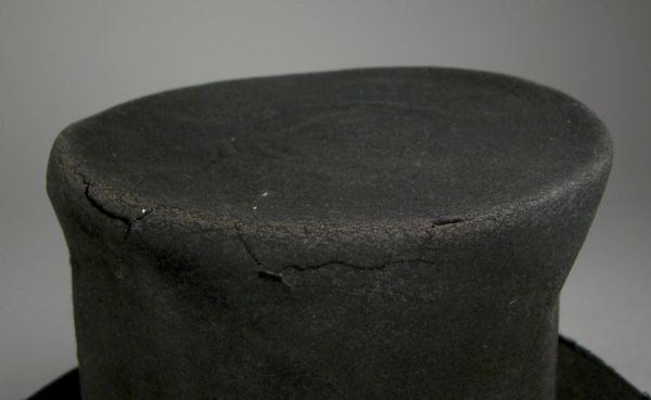 The frayed edge of a top hat made from beaver felt, worn by Green Bay resident Morgan L. Martin.