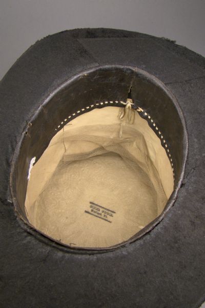 View of the inside of a top hat made from beaver felt, worn by Green Bay resident Morgan L. Martin. The maker's label reads: "Orel Cook, Rutland, Vt."