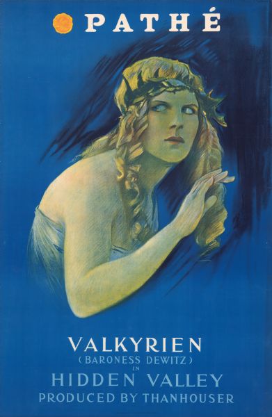 Poster for the film <i>Hidden Valley</i> featuring Valkyrien (Baroness Dewitz). Features an image of a woman with long curly blonde hair wearing a laurel wreath on her head.  She looks to the side out of the corner of her eye. The film was produced by Thanhouser.