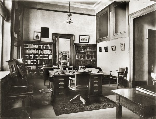 Photographs illustrating the general history of the State Historical Society of Wisconsin. Included are interior and exterior views of facilities and building construction.