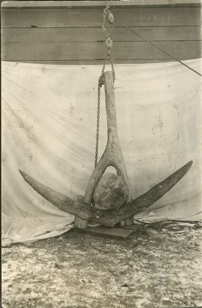 An old ship anchor of wood and stone which was lost from the three-masted schooner <i>Enterprise</I> in the 50's, and recovered from Lake Winnebago.